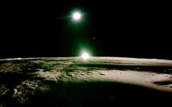 This handout photograph taken by Firefly Aerospace on March 16, 2025 and released on March 18, shows the lunar surface and the setting sun with Earth and Venus on the horizon, during the lunar mission of Firefly's Blue Ghost lunar lander