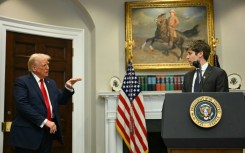 US President Trump gestures as CEO of Open AI Sam Altman speaks at the White House in January