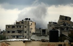 Smoke billows after an Israeli strike near the Bureij refugee camp in the central Gaza Strip
