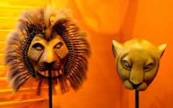 Foreign visitors often visit New York's Broadway theater district to see shows such as 'The Lion King' -- masks from the show are on display at the Museum of Broadway in Times Square