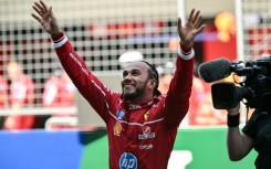 Lewis Hamilton celebrates winning the sprint race of the Formula One Chinese Grand Prix