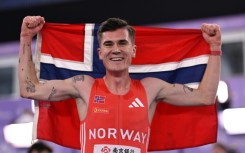 Norway's Jakob Ingebrigtsen celebrates winning he men's 3000m final at the Indoor World Athletics Championships in Nanjing, China