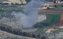An Israeli shell hits farmland near the south Lebanon village of Yohmor as defence chiefs threaten a severe response to renewed rocket fire from Lebanon.