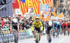 Team Visma's British rider Matthew Brennan (C) snatched victory in stage one of the Tour of Catalonia