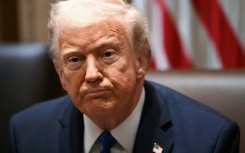 US President Donald Trump said he would 'look into' the use of the Signal app and has put on a united front