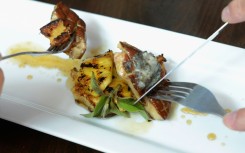 Customers eat gourmet food made with foie gras at Hot's Kitchen during a "Farewell Fois Gras" event on June 29, 2012 in Hermosa Beach, California