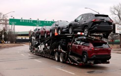 Vehicles like these Toyotas on their way to enter the United States from Canada are set to face 25 percent tariffs if they are not US-made, according to President Donald Trump