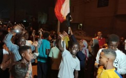 People take to the streets of Port Sudan to celebrate the army's recapture of the capital Khartoum