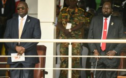 VP Riek Machar (L) and President Salva Kiir have a fragile 2018 power-sharing agreement
