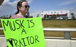 Demonstrators denounce Tesla CEO Elon Musk in Clermont, Florida, part of a day of protest against the tech billionaire on March 29, 2025