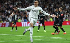 Real Madrid's French forward Kylian Mbappe struck twice as Los Blancos caught up with Barcelona in La Liga