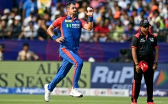 Mitchell Starc (L) delivers a ball during the IPL match between Delhi Capitals and Sunrisers Hyderabad