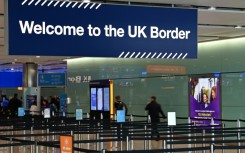 A large sign welcomes travellers arriving at passport control in Terminal 2 at London's Heathrow Airport