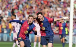 Barcelona striker Robert Lewandowski (R) hit a brace in the win over Girona on Sunday in La Liga