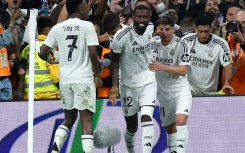 Real Madrid's German defender Antonio Rudiger (C) celebrates scoring his team's fourth goal against Real Sociedad