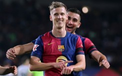 Barcelona midfielder Dani Olmo (front) has been playing under a temporary measure granted by Spain's sports council