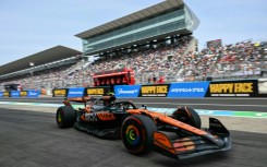 McLaren's British driver Lando Norris returns to the pits