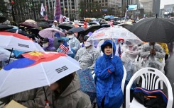 Yoon's supporters took to the streets in capital Seoul and braved the rain, chanting slogans against his removal from office