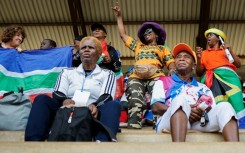 The crowd applauded as teams entered the stadium hand in hand with young mascots