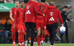 Bayern Munich midfielder Jamal Musiala is helped from the field with a hamstring injury