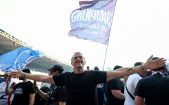 PSG coach Luis Enrique leads the celebrations after his side clinched the Ligue 1 title on Saturday