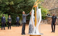 Rwandan President Paul Kagame (C) spoke about countries that have issued sanctions against it during an event to mark the start of commemorations for the 1994 genocide
