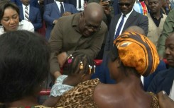 DR Congo's Tshisekedi visits flood victims at gymnasium in capital