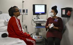 Towana Looney (L) is seen in NYU Langone Hospital in New York on December 11, 2024, just weeks after receiving a transplanted pig kidney