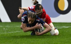 Emilie Boulard dives over the line to score for France against Scotland
