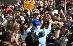 Mentions of Elon Musk, the owner of Tesla and X, drew boos from the crowd