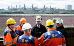 British Steel staff members gather at the plant as they take over its running from the Chinese owners Jingye