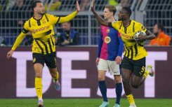 Serhou Guirassy (R) scored a hat-trick but was unable to help his side come back against Barcelona