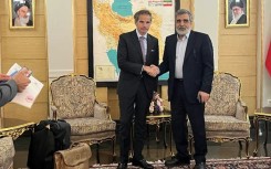 An Iranian Atomic Energy Organization picture shows IAEA chief Rafael Grossi (L) with IAEO spokesman Behrouz Kamalvandi in Tehran