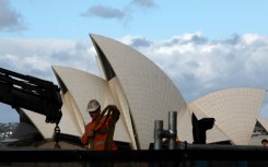 Prime Minister Anthony Albanese promised to defend Australia's interests in its trade tussle with the United States during a televised election debate with opposition leader Peter Dutton