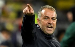 Barcelona coach Hansi Flick reacts during the Champions League quarter-final second leg against Borussia Dortmund on April 15, 2025