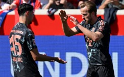 Bayern Munich forward Harry Kane (R) scored his 24th league goal of the season against Heidenheim