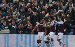 Aston Villa's Ollie Watkins (L) celebrates after scoring against Newcastle