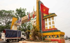 The flag of the Myanmar National Democratic Alliance Army (MNDAA) raised on a welcome arch in Lashio on April 9