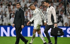 Kylian Mbappe hobbles of the pitch during REal Madrid's Champions League quarter final tie with Arsenal at the Santiago Bernabeu