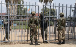 Members of the M23 movement stand at the gate of the local government offices in Bukavu in this March 2025 photo