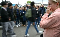 Concerned parents gathered outside of the Notre-Dame de Toutes-Aides secondary school after the attack