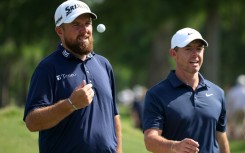 Defending champions Shane Lowry, left, and Rory McIlroy, right, combined to fire a 69 to move into contention after two rounds of the PGA Zurich Classic