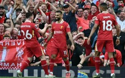 Mohamed Salah (C) celebrates scoring for Liverpool againt Tottenham Hotspur at Anfield