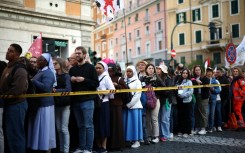 As the first rays of the day rose over the sprawling Baroque plaza, mourners rushed towards empty chairs