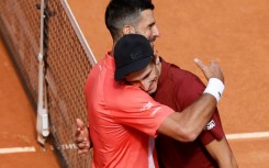 Novak Djokovic (l) congratulates his conqueror Matteo Arnaldi in Madrid