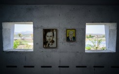 Hung between the bunker's narrow loopholes overlooking the North are cartoonist Kim Dae-nyeon's arwork