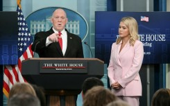 White House 'border czar' Tom Homan speak as White House Press Secretary Karoline Leavitt looks on during the daily briefing in the Brady Briefing Room of the White House in Washington, DC, on April 28, 2025