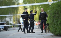 Swedish police sealed off a hair salon in the city of Uppsala where three people were killed in a shootout