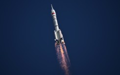 A Long March-2F carrier rocket, carrying the Shenzhou-20 spacecraft and a crew of three astronauts, lifts off