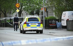 Police officers cordoned off the scene after the shooting in Uppsala